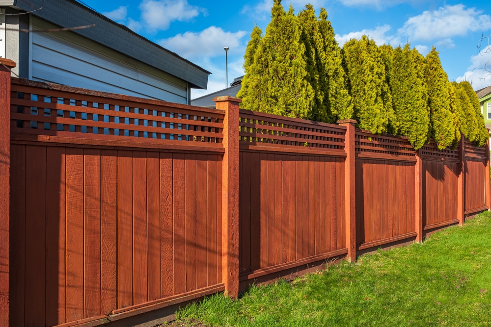 nicenewwoodenfencearoundhousewoodenfencewithgreen top interior exterior painters victoria bc van isle paint