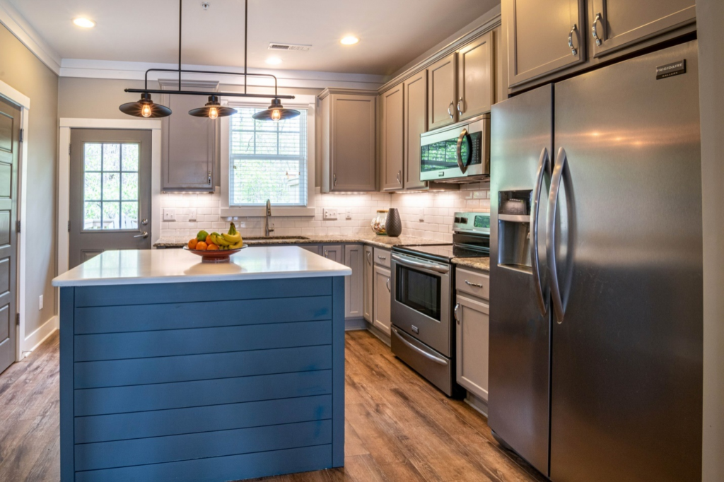 a big island and fridge in a kitchen top interior exterior painters victoria bc van isle paint