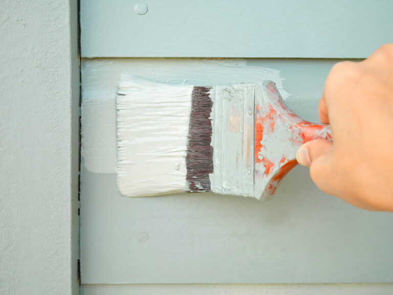 handholdingbrushpaintingtimberwall top interior exterior painters victoria bc van isle paint