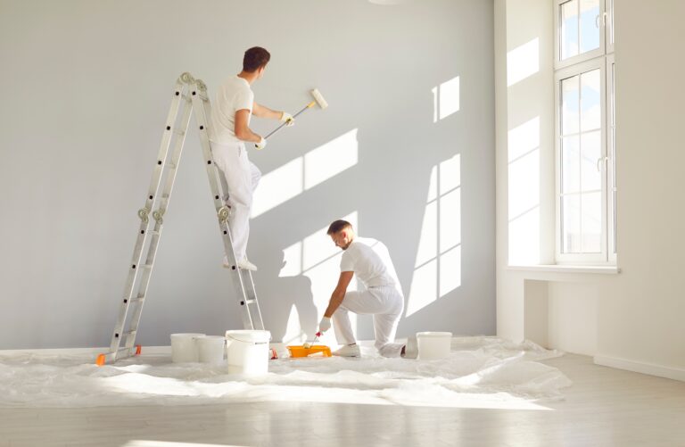 teamofprofessionalpaintersinwhiteclothespaintingagrey top interior exterior painters victoria bc van isle paint